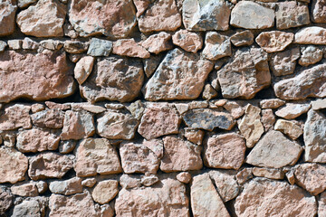 Old stone wall. Beautiful stone architecture. Wall texture. Wall patterns