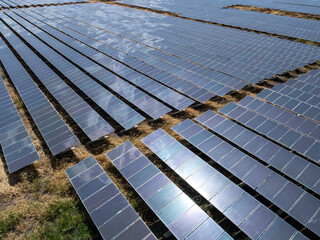 Aerial view of solar panel and power station with energy storage.