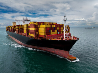 logistic cargo container ship sailing in sea to import export goods and distributing products to...