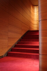 Obraz premium Theater staircase with red carpet and wooden wall