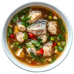 Close up of a bowl of fish soup with herbs and red chili peppers inside