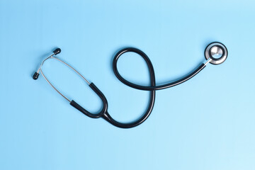 Stethoscope isolated on light blue background. Cardiology concept