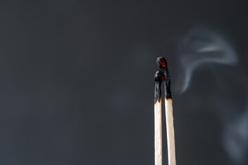Burned matches. Abstract concept of burnout in couple, copy space