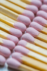 Pink matches sticks on bright background, macro photo