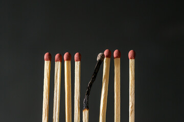 Matches and one burned match. Abstract concept of burnout, stress and depression