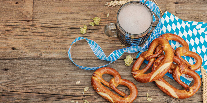 Traditional Oktoberfest set. Pretzels and beer, German festival food concept. Trendy hard light