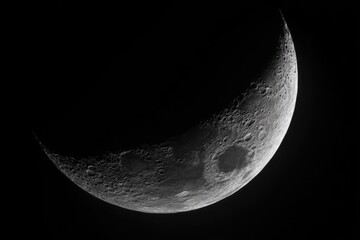 Naklejka premium HighResolution of a Waxing Crescent Moon, Clearly Showing Lunar Craters Detail