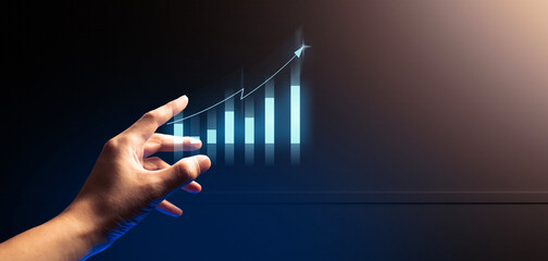 hand of businessman interactive touching a holographic of transaction financial network data...