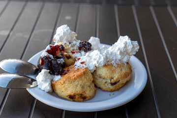 scone , cranberry scone or scone with whipped cream and strawberry jam or strawberry dressing