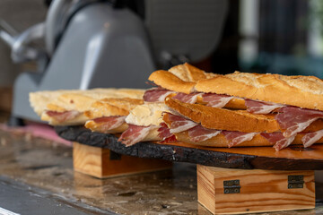 Ham sandwiches for sale on the street in Lisbon old town Portugal