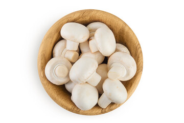 Fresh mushroom champignon in a wooden bowl isolated on white background. Top view. Flat lay