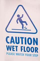 Yellow Caution wet floor sign on wet floor