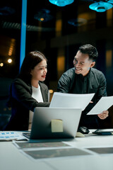 Teamwork colleagues working in the evening to develop or plan discussions, suggestions or ideas with business men and women working in the evening.