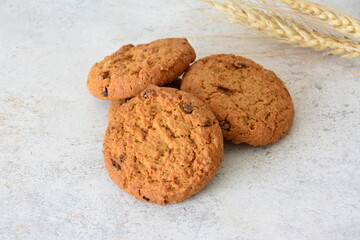 Pile of freshly baked oatmeal cookies with chocolate chips