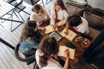 Top down view. Group of young friends are in the cafe restaurant © standret