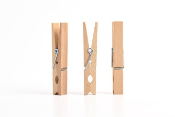 Set of Wooden clothes pin isolated on white background