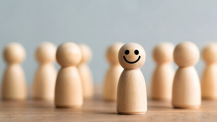 Wooden figurines showcase a positive attitude with happy face in business settings, emphasizing leadership, teamwork, and a focus on success among colleagues.