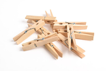 Pile of Wooden clothes pin isolated on white background