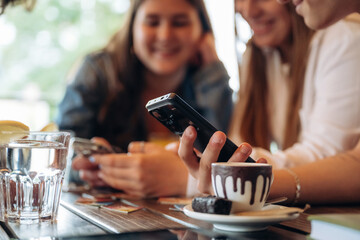 Leisure, having fun. Group of young friends are in the cafe restaurant