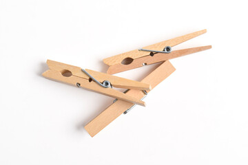 Wooden clothes pin isolated on white background. Top view, flat lay
