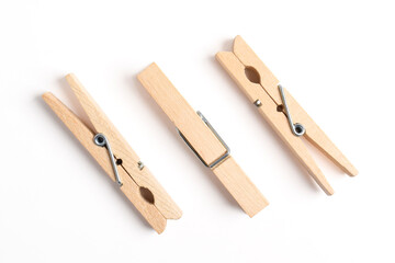 Wooden clothes pin isolated on white background. Top view, flat lay