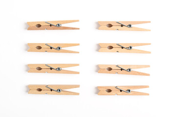 Wooden clothes pin isolated on white background. Top view, flat lay