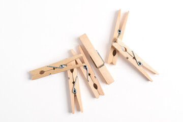 Wooden clothes pin isolated on white background. Top view, flat lay