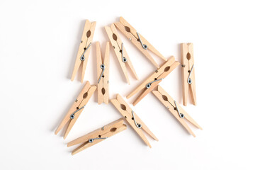 Wooden clothes pin isolated on white background. Top view, flat lay