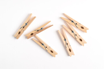 Wooden clothes pin isolated on white background. Top view, flat lay