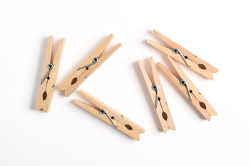 Wooden clothes pin isolated on white background. Top view, flat lay