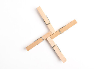 Wooden clothes pin isolated on white background. Top view, flat lay