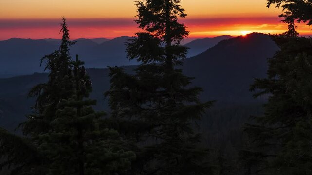 Sunset bright pink orange sky in the mountains 