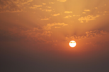 Sunset in the evening sky. Celestial colorful background with beautiful clouds
