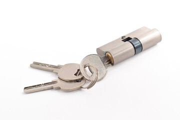 The cylinder of the lock with a pair of keys and isolated on the white background.