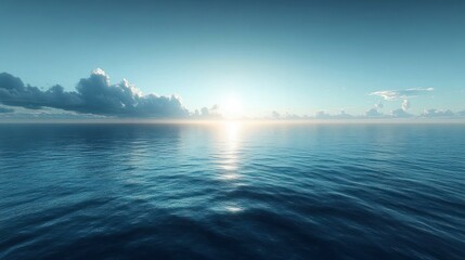 Obraz premium Calm ocean water under a clear sky at sunrise with scattered clouds on the horizon reflecting soft light on the rippling surface