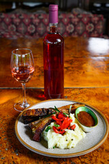 Pork ribs with mashed potatoes and sauce with wine