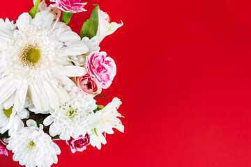 Bouquet with chrysanthemums on a plain red background, greeting card layout.