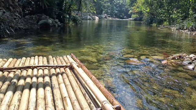 traveling sailing bamboo raft on river in tropical forest jungle