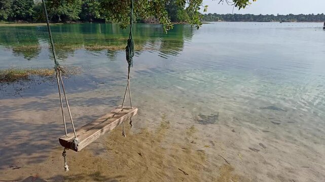 swing near river creek. Resting holiday vacation at lake