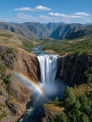 Obraz premium Breathtaking Drone Capture of a Massive Waterfall with Rainbow