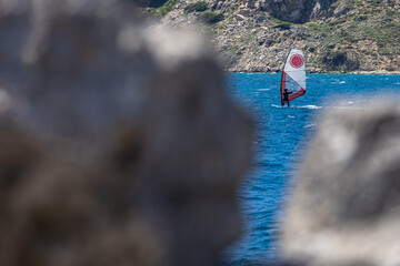Windsurfing and paragliding in the bay by the beach in Baska on the island of KRK,