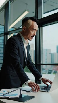 Bald in the middle head and begin no loss hair glabrous of mature Asian business smart active office man.