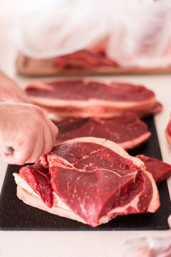 portioning out a rump into steaks