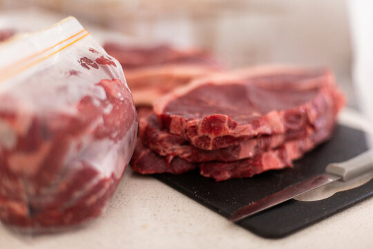 portioning out steaks into meal sized bags for storage