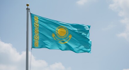 Kazakhstan's vibrant flag billows proudly against a bright blue sky.