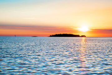 Incredibly beautiful romantic landscape with sunset at sea between the islands (vacation, rest, harmony, meditation, honeymoon - concept)