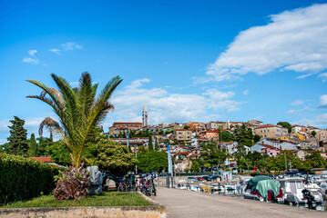Breathtaking view of the church tower in Porec, Croatia from the waterfront with boats