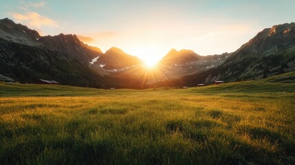 Obraz premium A breathtaking sunset illuminating a majestic mountain range, casting warm hues over a lush green valley, capturing the beauty of nature and serene landscapes.