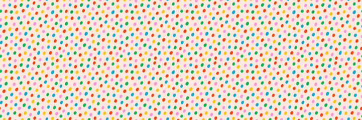 Seamless multicolor dot pattern background on cream. Confetti polka dot vector with playful, colorful, and abstract print style. Great for party wrapping paper, fabric. Drag to swatches panel to use