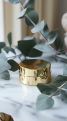 Luxury Eye Cream in Gold Jar on Marble with Eucalyptus